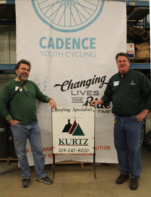 Bicycle Coalition executive director Alex Doty and Kurtz Construction warehouse supervisor Kevin Reilly