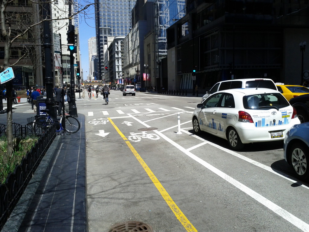 Two-way protected bike lane (using parked cars) on Dearbourne Street in Chicago