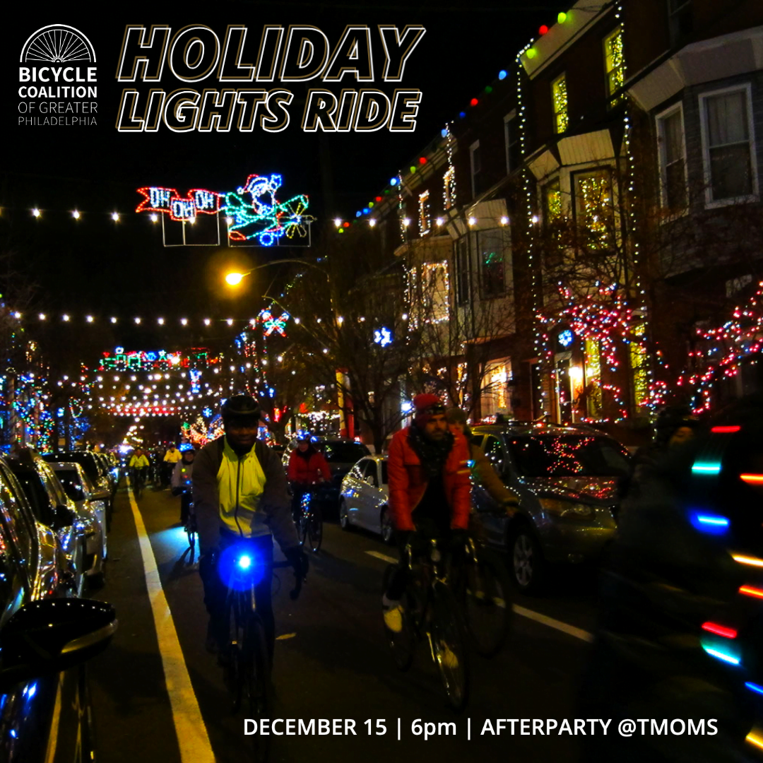 Holiday Lights riders roll through the street at night, backdrop of multicolored lights and decorated houses