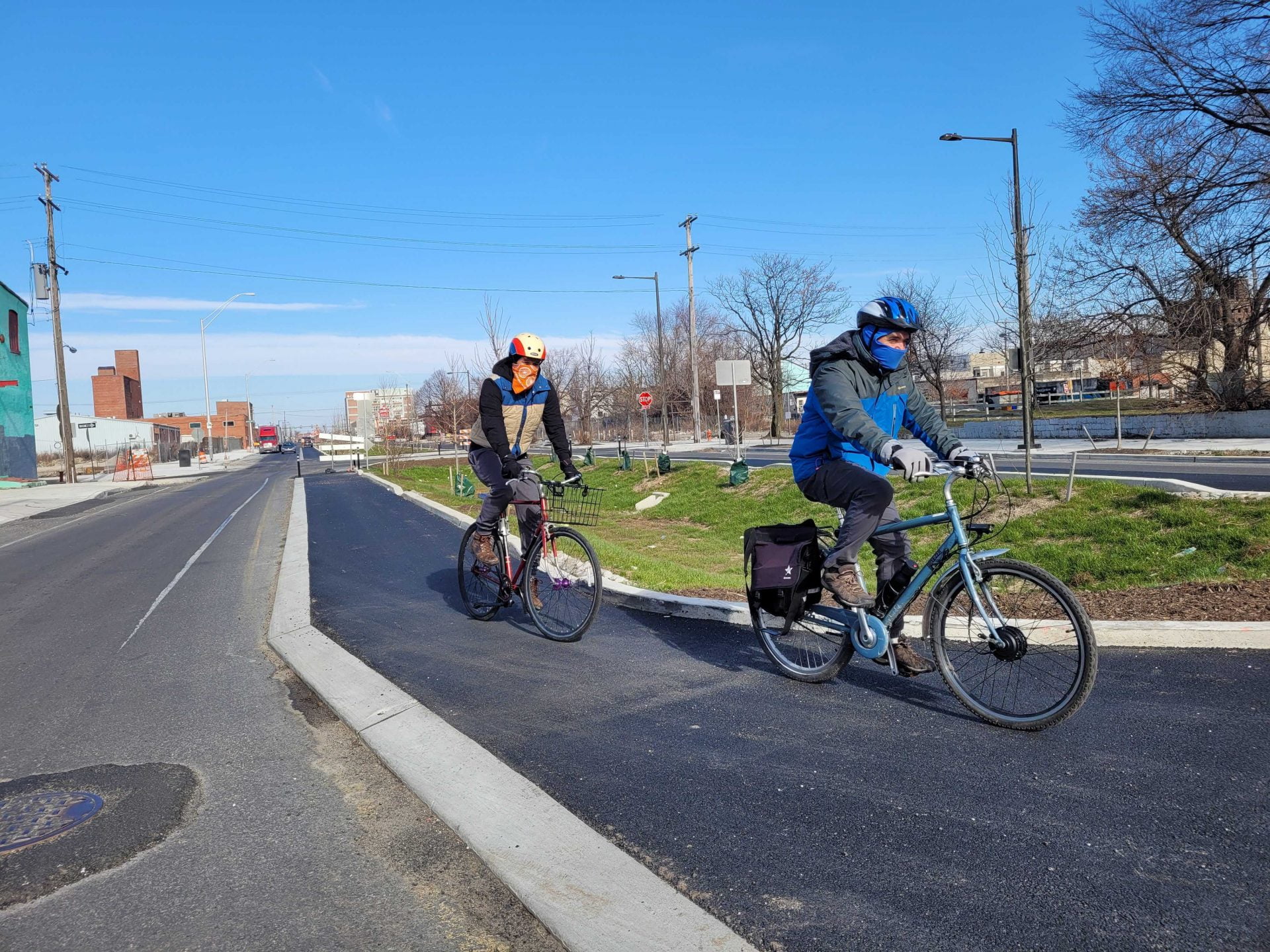 John & Randy ride on the new American Street protected bike lane in early 2021