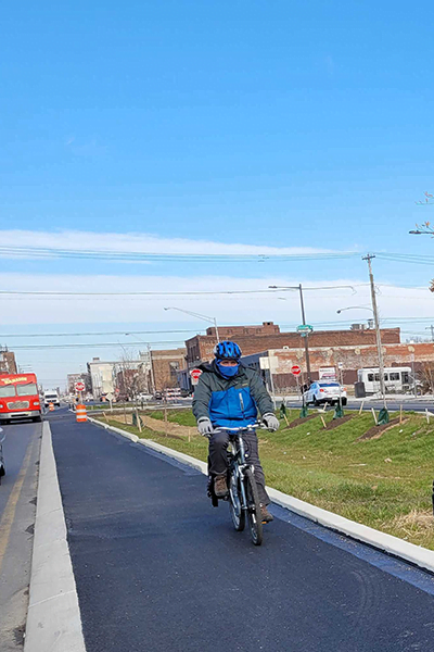 John Boyle riding in the American Street protected bike lane